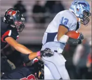  ?? MEDIANEWS GROUP FILE PHOTO ?? North Penn’s Dominic Taggart (13) breaks free of Hatters defenders for a big gain during first-half action of their contest at Hatboro Horsham high School on Friday October 29,2010.