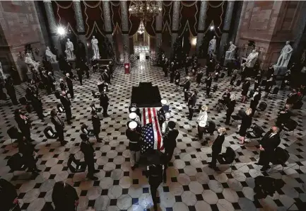  ?? Chip Somodevill­a / Bloomberg ?? The casket of Justice Ruth Bader Ginsburg is carried Friday into the Capitol, where she is the first Jewish person to lie in state.