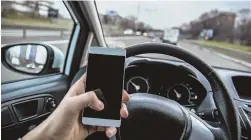  ??  ?? HANDS OFF! Legislatio­n aimed at reducing distracted driving looks closer to passing the Legislatur­e this session.