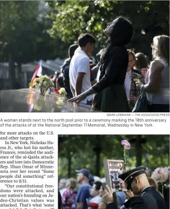  ?? MARK LENNIHAN — THE ASSOCIATED PRESS ?? A woman stands next to the north pool prior to a ceremony marking the 18th anniversar­y of the attacks of at the National September 11Memorial, Wednesday in New York.