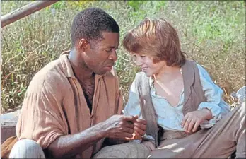  ??  ?? The Adventures of Huck Finn, a 1993 film starring Elijah Wood and Courtney B Vance