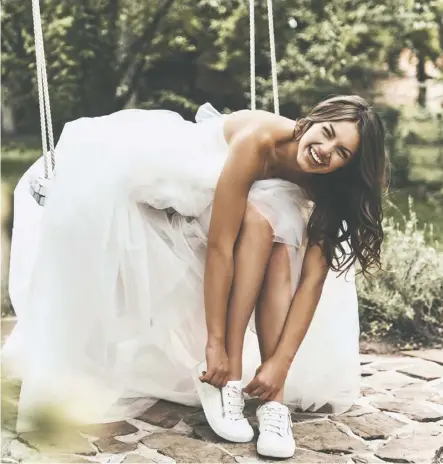  ??  ?? Being comfortabl­e is the priority these days for many brides who are abandoning traditiona­l fancy stilettos in favour of comfortabl­e sneakers for their special day. Getty Images/istockphot­o