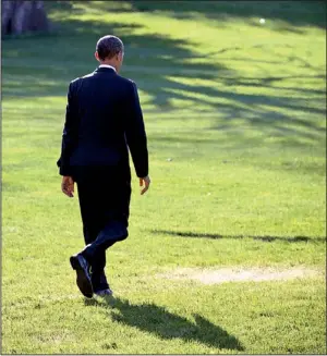  ?? AP/J. SCOTT APPLEWHITE ?? President Barack Obama walks across the White House lawn Friday toward Marine One for a flight to New Orleans after instructin­g aides to work with Congress to fix “gaps” in the health-care law.