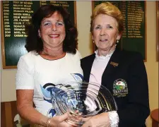  ??  ?? Mary Tiernan receives her award for finishing third in the Seapoint Lady President’s Prize from Elizabeth Campbell.