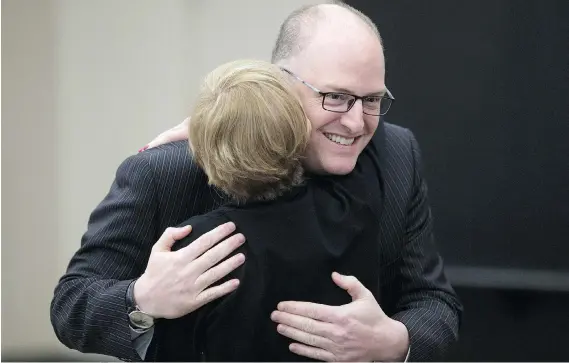  ?? DAX MELMER ?? Mayor Drew Dilkens, re-elected to his second term, gets a hug from chief of staff Norma Coleman at the St. Clair Centre for the Arts.