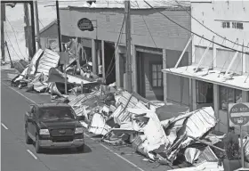  ?? STEVE HELBER/AP ?? While efforts to assess damage are just underway, an early estimate from Fitch Ratings says Hurricane Ida will cost insurance companies $15 billion to $25 billion.