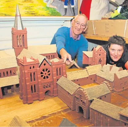  ??  ?? Willie Smith and his daughter Donna are hoping to have the model of Arbroath Abbey ready for the 700th anniversar­y of the Declaratio­n of Arbroath.