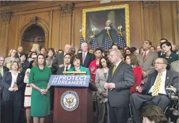  ?? Tasos Katopodis European Pressphoto Agency ?? REP. LUCILLE Roybal-Allard, center, speaking on Capitol Hill, proposed the Dream Act in 2001 to allow people brought to the country illegally as children to stay in the U.S. It failed to pass after several attempts.