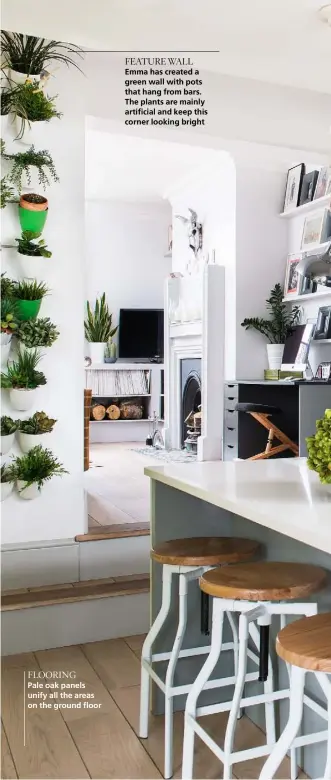  ??  ?? FLOORING
Pale oak panels unify all the areas on the ground floor
FEATURE WALL
Emma has created a green wall with pots that hang from bars. The plants are mainly artificial and keep this corner looking bright