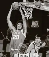  ?? Kyle Phillips / Associated Press ?? Hot starts from Texas senior Jericho Sims (20) tend to bode well for the Longhorns, who held on to win.