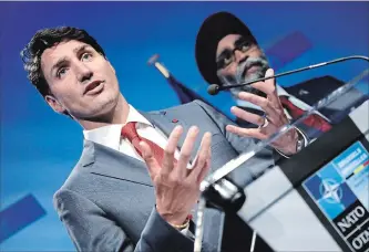  ?? OLIVIER MATTHYS THE ASSOCIATED PRESS ?? Canadian Prime Minister Justin Trudeau speaks at a press conference after a summit of heads of state and government at NATO headquarte­rs in Brussels, Belgium, Thursday, July 12, 2018.