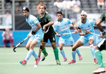  ??  ?? Dilpreet Singh ( left) in action against Pakistan in their opening match of the Champions Trophy hockey tournament in Breda, the Netherland­s, on Saturday. India won 4- 0 with 17- year- old Dilpreet getting one of the goals.