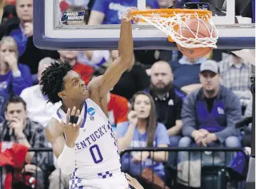  ?? JOE ROBBINS / GETTY IMAGES ?? De’Aaron Fox of the Kentucky Wildcats dunks against the Wichita State Shockers in the second half during the second round of the NCAA Men’s Tournament on Sunday in Indianapol­is, Ind. Fox had 14 points.