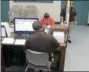  ?? KAUFMAN COUNTY SHERIFF’S OFFICE JAIL VIA AP ?? This photo from video released Thursday, Sept. 13, by the Kaufman County Sheriff’s Office in Kaufman, Texas, shows Dallas police Officer Amber Guyger getting booked after turning herself in Sunday, Sept. 9 following the fatal shooting of Botham Jean in his own apartment. Guyger was arrested on a manslaught­er charge and has since been released on bond.