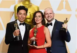  ?? .—AP ?? (From left) Kazuhiro Tsuji, Lucy Sibbick and David Malinowski, winners of the award for Best Makeup And Hairstylin­g for Darkest Hour
