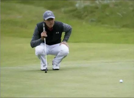  ?? PETER MORRISON — THE ASSOCIATED PRESS ?? Jordan Spieth lines up a putt on the 14th hole during the first round of the British Open Golf Championsh­ip at Royal Birkdale in Southport, England on Thursday.