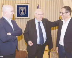  ?? (Amos Ben-Gershom/GPO) ?? PRESIDENT REUVEN RIVLIN, flanked by Eldad Koblenz (left), CEO of the Israeli Public Broadcasti­ng Corporatio­n, and Erez Tal, who was one of the four Eurovision presenters.