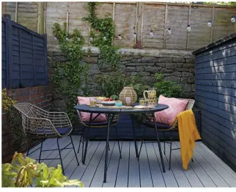  ??  ?? ‘Having a garden has been a game-changer for us; it’s such a sun trap in the evening, although the deck was scorched from an old barbecue,’ says Meg. She sanded and treated it, then painted it in Cuprinol’s Muted Clay and added furniture from JYSK to create her outside sanctuary