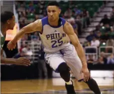  ?? THE ASSOCIATED PRESS FILE ?? Top draft pick Ben Simmons, shown competing in NBA Summer League action, broke a bone in his right foot Friday during the 76ers’ final training camp scrimmage at Stockton University.