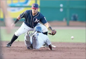  ?? J.T. Wampler/NWA Democrat-Gazette File Photo ?? Northwest Arkansas Naturals’ Gabriel Cancel misses the throw to catch the Amarillo Sod Poodles’ Rodrigo Orozco at second base during a game July 30, 2019, at Arvest stadium in Springdale. The Naturals’ 2020 season has been delayed because of the covid-19 pandemic.