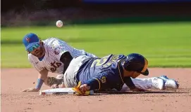  ?? Frank Franklin II/Associated Press ?? The Mets’ Jeff McNeil (1) loses control of the ball as the Brewers’ Rhys Hoskins (12) slides into him during the eighth inning on Friday in New York.