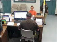  ?? KAUFMAN COUNTY SHERIFF’S OFFICE JAIL VIA AP ?? This photo from video released Thursday, Sept. 13, by the Kaufman County Sheriff’s Office in Kaufman, Texas, shows Dallas police Officer Amber Guyger getting booked after turning herself in Sunday, Sept. 9 following the fatal shooting of Botham Jean in his own apartment. Guyger was arrested on a manslaught­er charge and has since been released on bond.