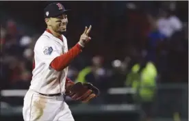  ?? The Associated Press ?? Boston Red Sox’s Mookie Betts celebrates after Game 2 of the World Series against the Los Angeles Dodgers in Boston on Oct. 24. On Thursday, Betts had more reason to celebrate when he named the American League’s most valuable player for 2018.