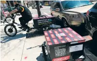  ?? TALI ARBEL/ASSOCIATED PRESS ?? A worker sets out to make a delivery in front of Gorillas mini-warehouse in the Brooklyn borough of New York on Monday. Gorillas is one of several companies venture capitalist­s have poured billions into in the latest delivery craze.