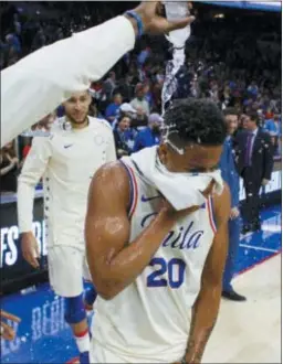  ?? CHRIS SZAGOLA — THE ASSOCIATED PRESS ?? Sixers rookie Markelle Fultz gets an NBA-style baptismal after posting his first triple-double in the team’s regular season finale victory over Milwaukee Wednesday.