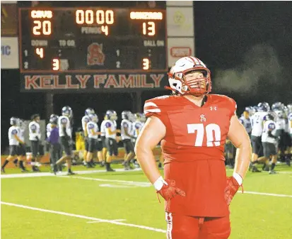  ?? PAUL W. GILLESPIE/CAPITAL GAZETTE PHOTOS ?? Spalding’s Matthew Benny, who had a big fumble recovery earlier, takes it all in after the defense stopped Gonzaga in overtime for the win. The Cavaliers defeated the visiting Eagles 20-13 in overtime on Friday.