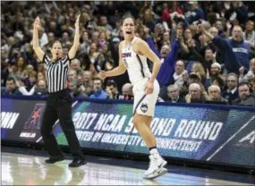  ?? JESSICA HILL — THE ASSOCIATED PRESS ?? Connecticu­t’s Kia Nurse reacts after hitting a 3-point basket in the first half of a secondroun­d game against Syracuse in the NCAA women’s basketball tournament on Monday.