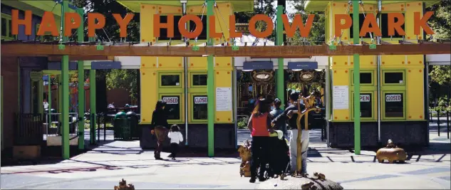  ?? FILE: PATRICK TEHAN — STAFF ARCHIVES ?? Visitors enter Happy Hollow Park and Zoo in San Jose in 2010. The facility will reopen after being closed for months.