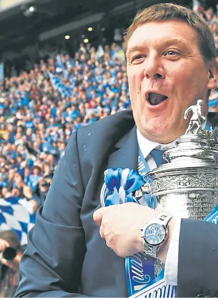  ?? Picture: SNS Group. ?? Tommy Wright, who has left St Johnstone after seven years in charge, pictured with the Scottish Cup after his side’s famous win over Dundee United in 2014. The Northern Irishman admits the cup final squad will “always have a special place for me in terms of what they achieved that season”.