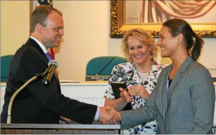  ?? SUBMITTED PHOTO ?? Adriana Zeiders is sworn in as a police officer by West Chester Mayor Jordon C. Norley.