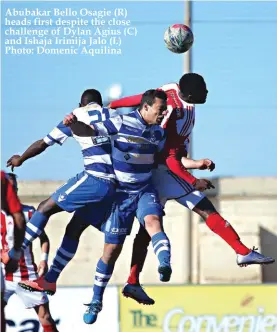  ??  ?? Abubakar Bello Osagie (R) heads first despite the close challenge of Dylan Agius (C) and Ishaja Irimija Jalo (L) Photo: Domenic Aquilina