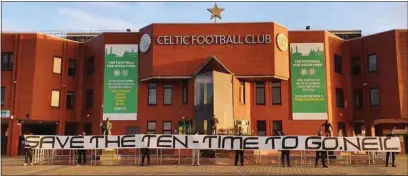  ??  ?? The Green Brigade displayed a banner outside Celtic Park this week calling for Lennon to leave