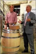  ?? ANNE NEBORAK — DIGITAL FIRST MEDIA ?? Chris Le Vine, owner of Grace Winery, and state Sen. Thomas Killian talk about new liquor laws in Pennsylvan­ia.