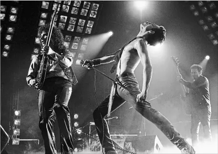  ?? ALEX BAILEY
THE ASSOCIATED PRESS ?? Gwilym Lee as Brian May, left, Rami Malek as Freddie Mercury and Joe Mazzello as John Deacon in a scene from “Bohemian Rhapsody.”