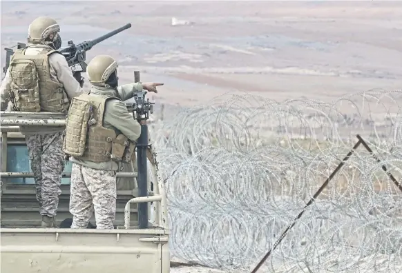  ?? PICTURE: KHALIL MAZRAAWI/AFP VIA GETTY ?? Jordanian soldiers patrol the border with Syria, looking for organised drug smugglers