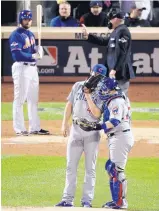  ?? AP FILE ?? Catcher Miguel Montero, right, has an on-themound visit with Cubs pitcher Jake Arrieta in this 2015 photo. On Tuesday, Montero ripped into Arrieta for his failure to hold players on base.