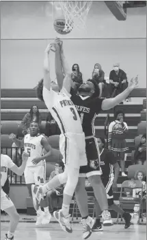  ?? Fred Conley • Times-Herald ?? Palestine-Wheatley's Connor White (3) goes high to battle a Jacksonvil­le Lighthouse player for a rebound in the second half of Tuesday's game played at Patriot Gym. Lighthouse won the game 44-31.