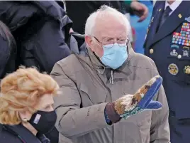  ?? Picture: AFP ?? KID’S GLOVES. Senator Bernie Sanders arrives at the inaugurati­on. His mittens caused a stir on social media.