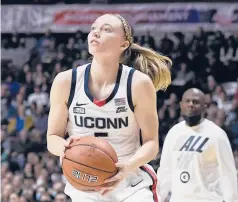  ?? JESSICA HILL /AP ?? In her third game back from a knee injury, Paige Bueckers got more involved, with 16 points, five rebounds and four assists in UConn’s 84-38 win over Georgetown on Saturday.