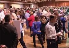  ??  ?? UNCORKED: Wine enthusiast­s fill an event at a previous New Hampshire Wine Week.