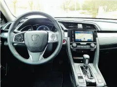  ??  ?? The 2018 Honda Civic Sedan Touring the cabin offers plenty of soft-touch materials and complement­ary trim.