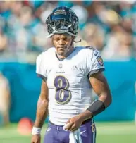  ?? GARY MCCULLOUGH/AP ?? Ravens quarterbac­k Lamar Jackson during a timeout in the first half in the game against the Jaguars on Sunday in Jacksonvil­le, Florida.