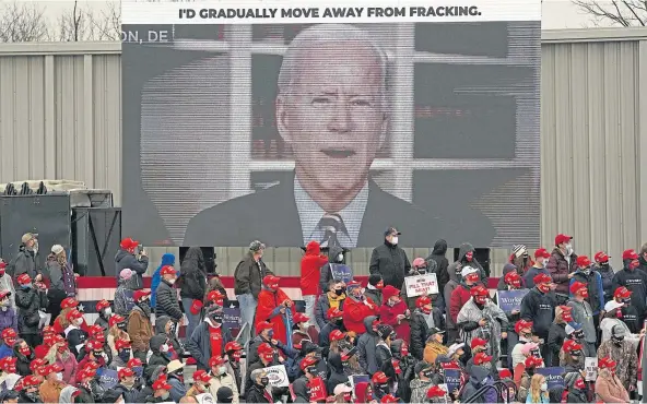  ??  ?? SWING STATE: Joe Biden on a video screen as President Donald Trump appears for a campaign rally in Northampto­n County in Pennsylvan­ia.