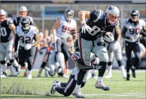  ?? AP PHOTO ?? New England Patriots tight end Rob Gronkowski (87) drags Houston Texans safety Andre Hal (29) as he runs after catching a pass during the second half of an NFL game on Sunday in Foxborough, Mass.