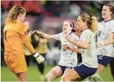  ?? GREGORY BULL/AP ?? Goalkeeper Alyssa Naeher, left, celebrates with teammates Wednesday night after making two saves and converting her own shot in a shootout that sent the U.S. women’s soccer team past Canada and into final of the inaugural CONCACAF Women’s Gold Cup.