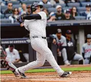  ?? Mary Altaffer/Associated Press ?? The Yankees’ Anthony Rizzo follows through after hitting a home run in the third inning Saturday.